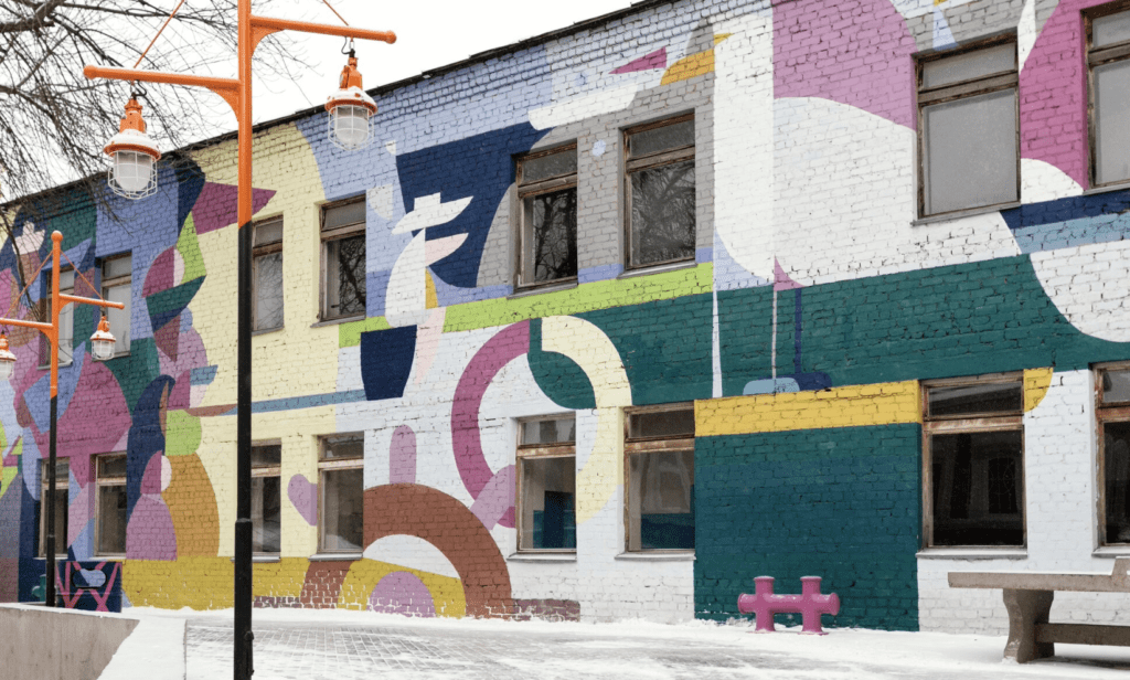 Guerrilla marketing through a community mural by a painting company.