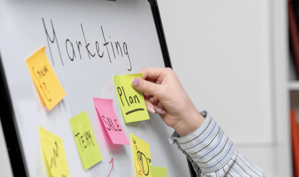 measuring success of online marketing for painting companies with a whiteboard and sticky notes